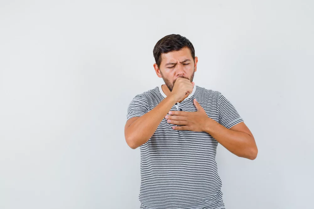 young man suffering from dry cough